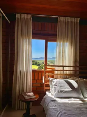 Uma cama ou camas num quarto em Oliveira mountain House