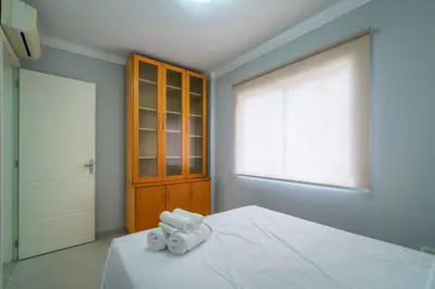 Uma cama ou camas num quarto em Apto Moderno Próx. à Praia em Itapema CB5328
