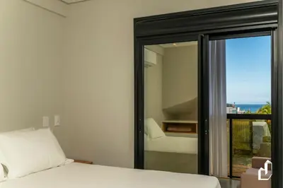 Uma cama ou camas num quarto em Apartamento para 05 pessoas com vista para o mar