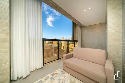 Uma área de estar em Apartamento para 05 pessoas com vista para o mar