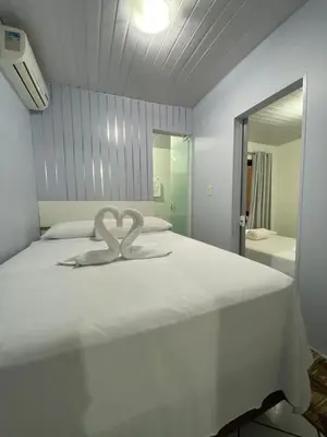 Uma cama ou camas num quarto em Casa na Praia Araçá