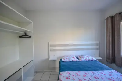 Uma cama ou camas num quarto em Residencial Rouxinol