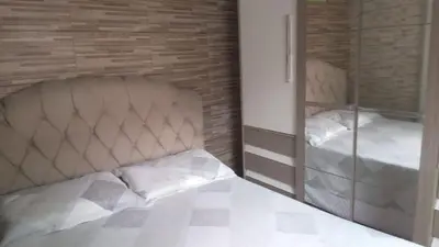 Uma cama ou camas num quarto em House of Cesar