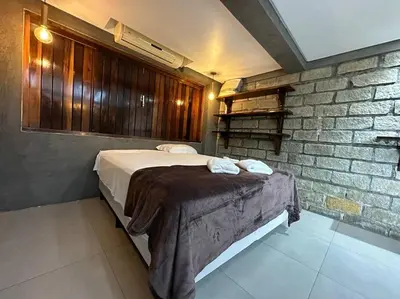 Uma cama ou camas num quarto em Apto 10, Temático Veuve Clicquot com Jacuzzi na Morada do Ganso