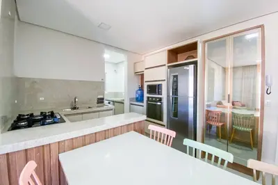 A cozinha ou kitchenette de Apartamento poucos metros da praia de Palmas - 0112