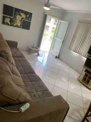 Uma área de estar em Apartamento 50 metros do Mar