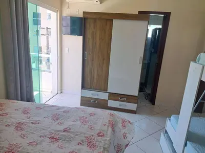 Uma cama ou camas num quarto em Praia de Palmas 2 Qtos 2 suítes