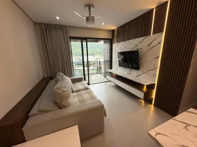 Uma televisão e/ou sistema de entretenimento em Cód 71 - Apto com 3 dormitórios no Duetto Home