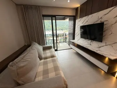 Uma televisão e/ou sistema de entretenimento em Cód 71 - Apto com 3 dormitórios no Duetto Home