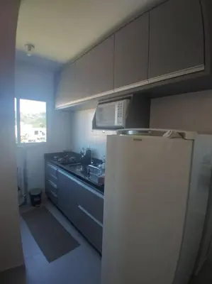 A cozinha ou kitchenette de Apart 1 dorm 1 banh na praia de Palmas Gov Celso R