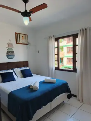 Uma cama ou camas num quarto em Residencial DO MAR