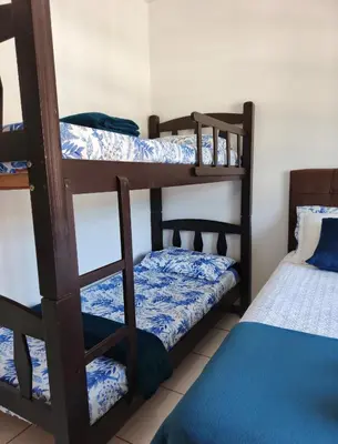 Uma cama ou camas num quarto em Residencial DO MAR