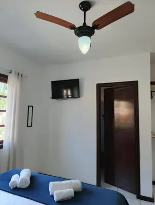 Uma cama ou camas num quarto em Residencial DO MAR