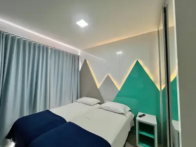 Uma cama ou camas num quarto em Residencial Mario Guilherme