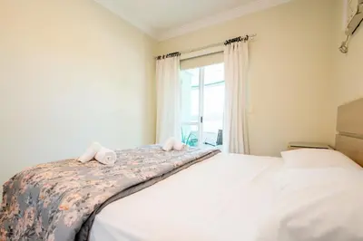 Uma cama ou camas num quarto em Apto a 250m da praia na Barra Sul SV7987