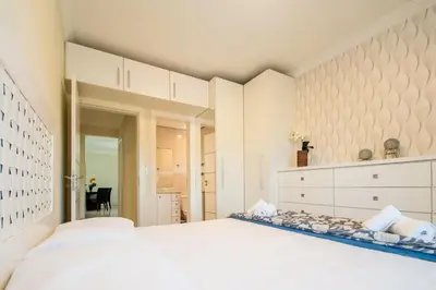 Uma cama ou camas num quarto em Apto a 250m da praia na Barra Sul SV7987