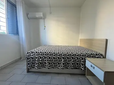 Uma cama ou camas num quarto em B208 - Apto 2 quartos Bombas perto do mar - SC