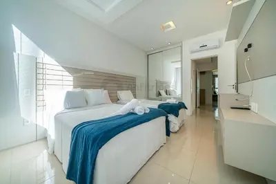 Uma cama ou camas num quarto em Apto moderno e equipado Itapema PF2379