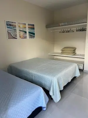 Uma cama ou camas num quarto em Apartamento em Bombinhas