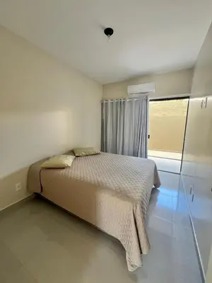 Uma cama ou camas num quarto em Apartamento em Bombinhas