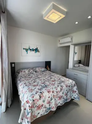 Uma cama ou camas num quarto em Duplex em Canto Grande