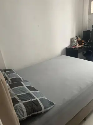 Uma cama ou camas num quarto em Apartamento em Bombas