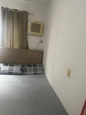 Uma cama ou camas num quarto em Apartamento em Bombas