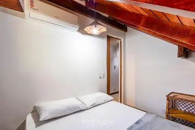 Uma cama ou camas num quarto em Casa 3Q Pé na Areia c/ churrasq. Bombinhas SDN042
