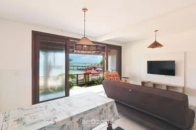 Uma televisão e/ou sistema de entretenimento em Casa 3Q Pé na Areia c/ churrasq. Bombinhas SDN042