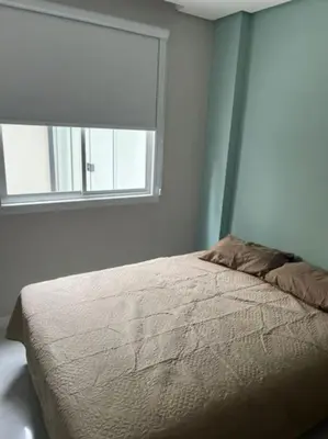 Uma cama ou camas num quarto em Pe na Areia Ap 2 quartos e terraço, Rua 3704