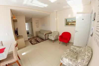 Uma área de estar em Apartamento com Piscina