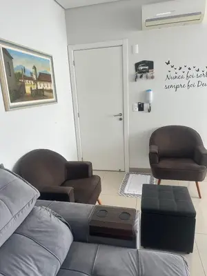 Uma área de estar em Apartamento com Piscina