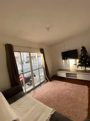Uma cama ou camas num quarto em Casa com tres dormitoria a uma quadra da praia