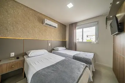 Uma cama ou camas num quarto em Residencial Caraíbas