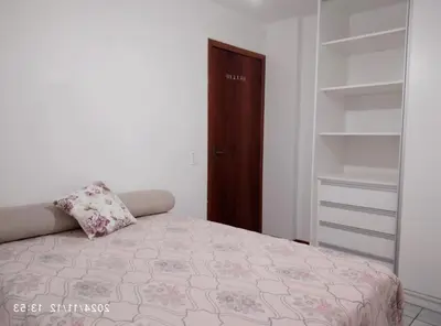 Uma cama ou camas num quarto em Apartamento confortável em Meia Praia