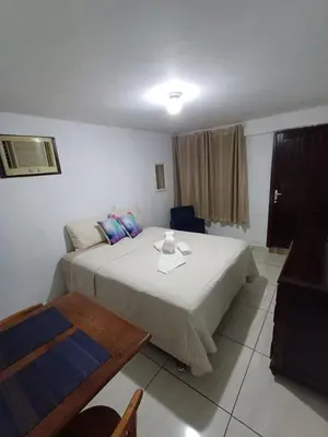 Uma cama ou camas num quarto em Suite Térrea