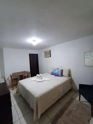 Uma cama ou camas num quarto em Suite Térrea