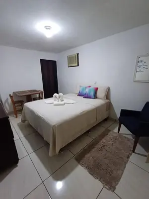 Uma cama ou camas num quarto em Suite Térrea