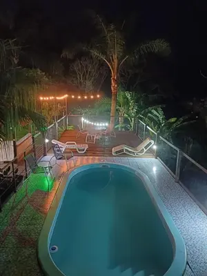 A piscina em ou perto de Suite Térrea