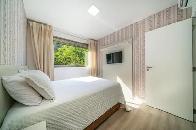 Uma cama ou camas num quarto em Residencial Puntablu