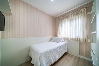 Uma cama ou camas num quarto em Residencial Puntablu
