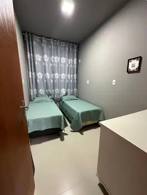 Uma cama ou camas num quarto em Casa na praia de bombas