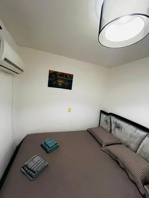 Uma cama ou camas num quarto em Apartamento Frente Mar Itapema