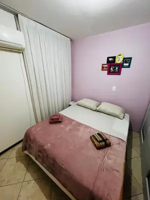 Uma cama ou camas num quarto em Apartamento Frente Mar Itapema