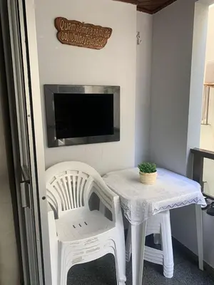 Uma televisão e/ou sistema de entretenimento em Apartamento Impecável, próximo ao mar!