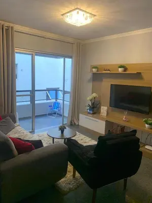 Uma televisão e/ou sistema de entretenimento em Apartamento Impecável, próximo ao mar!