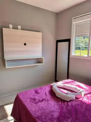 Uma cama ou camas num quarto em Apartamento na praia de palmas