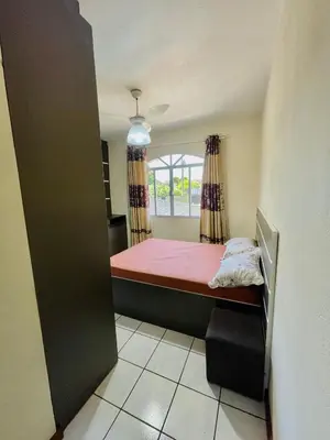 Uma cama ou camas num quarto em Casa de Ferias Em Governador Celso Ramos