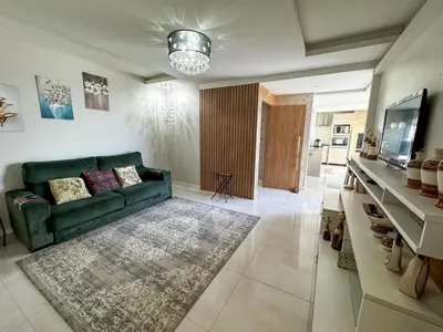 Uma área de estar em Apartamento Vista mar