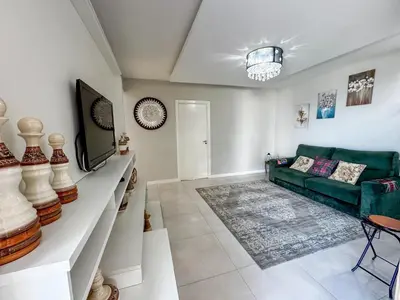 Uma área de estar em Apartamento Vista mar